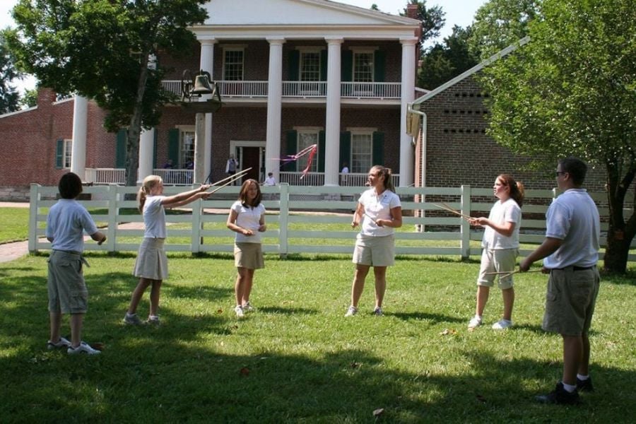 Children are playing a game in front of President Andrew Jackson’s house, The Hermitage.