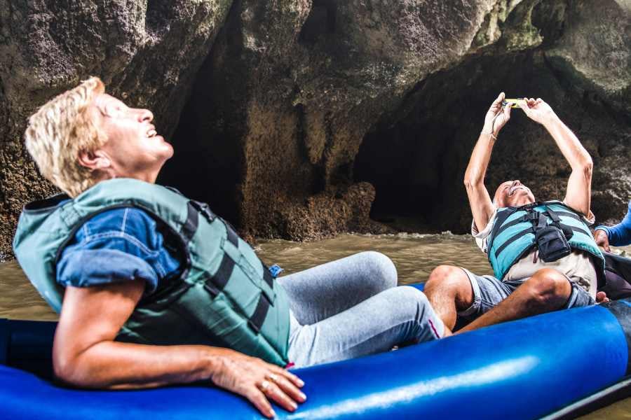 Two people are visiting a cave