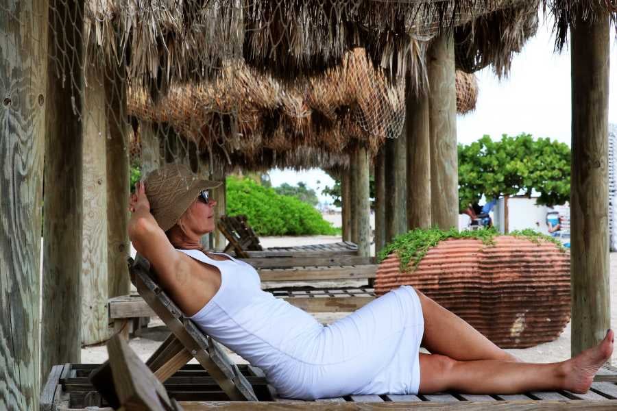 A woman is relaxing on the beach