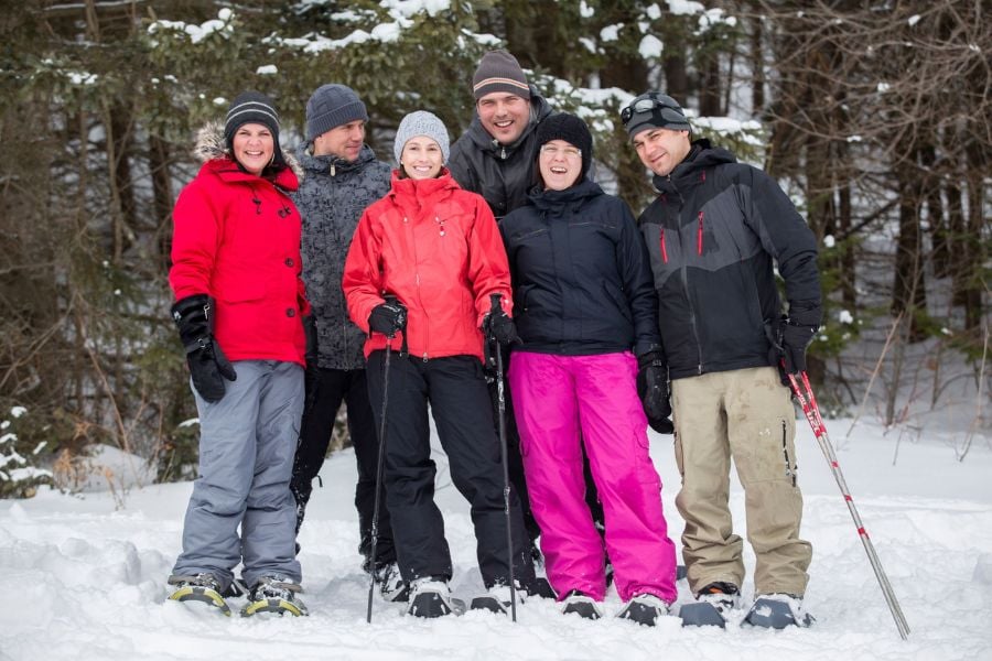 Friends enjoy a winter hike on Breckenridge&rsquo;s snowy mountain trails.