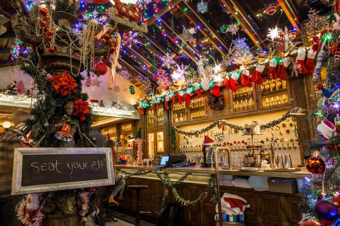 oliday market in Nashville with vendors, Christmas trees, and festive shoppers