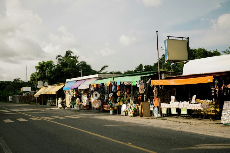 Colorful market stalls line a quiet street in Costa Maya.