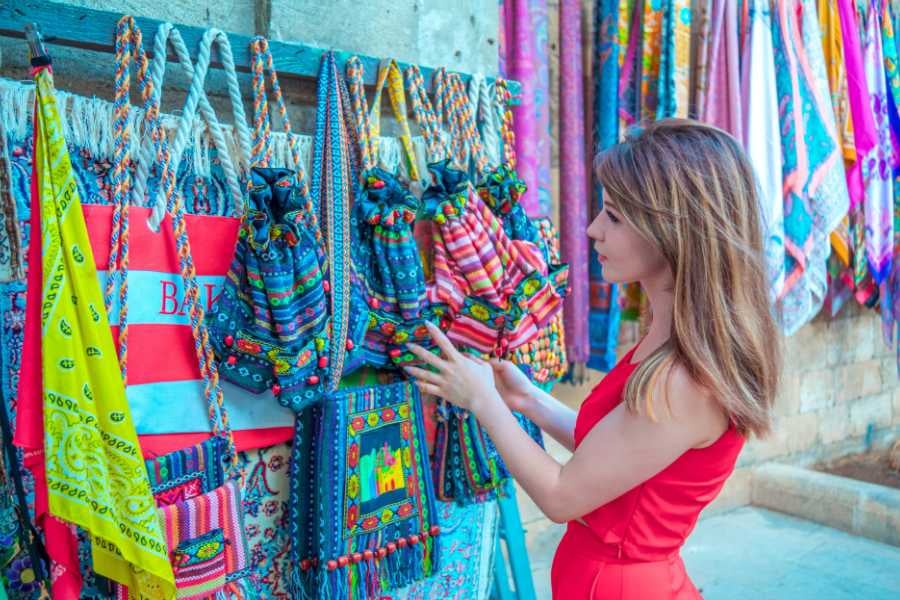 A girl buying handmade bags