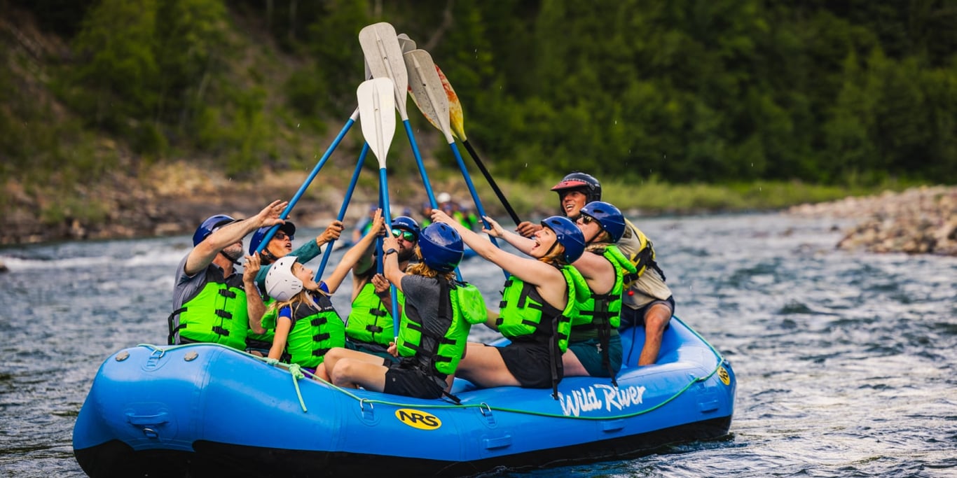 Whitewater raft navigating rapids on the Middle Fork of the Flathead River near Columbia Falls and West Glacier