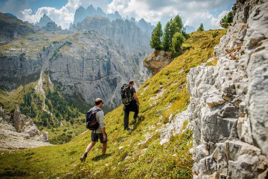 Two people are hiking in the mountains