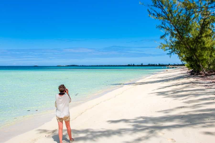 A woman is walking on the beach