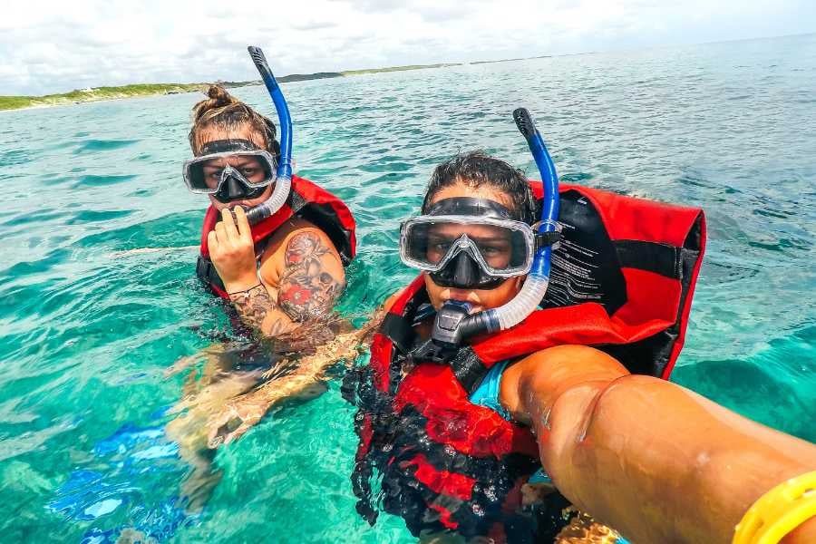 Two people are ready to dive into the water