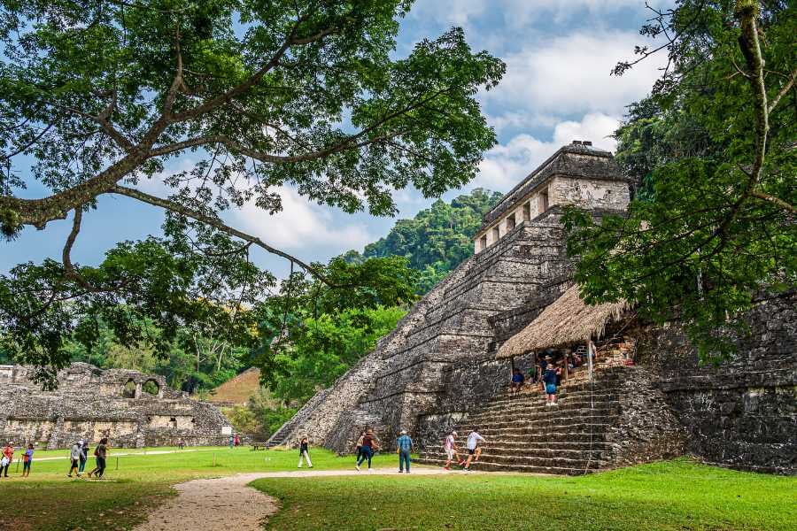 Tourists are visiting the kohunlich ruins.