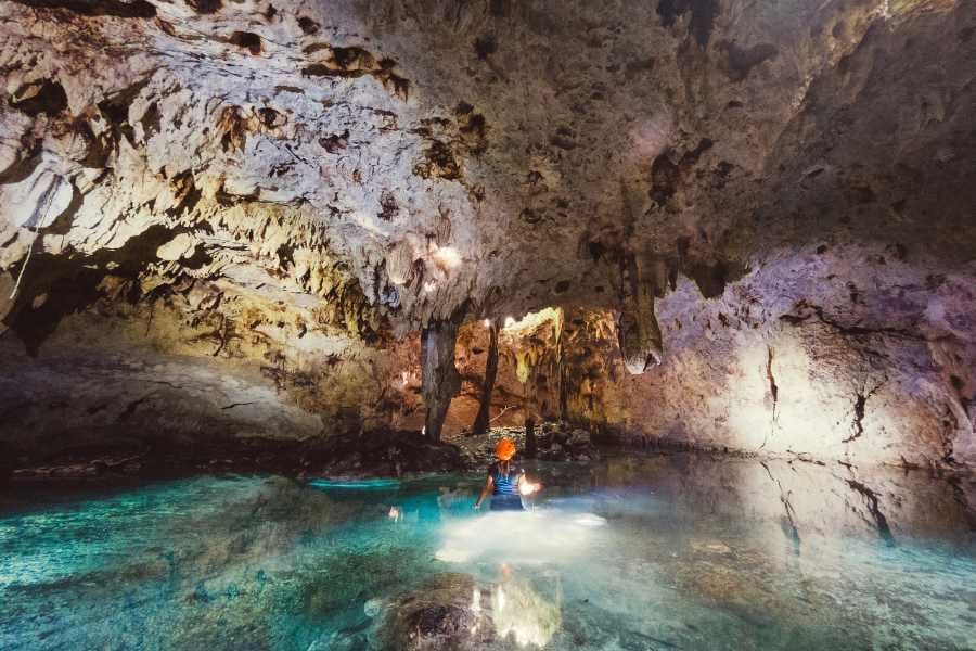 A girl is visiting a cave