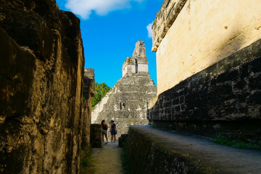 Two girls are visting Mayan ruins