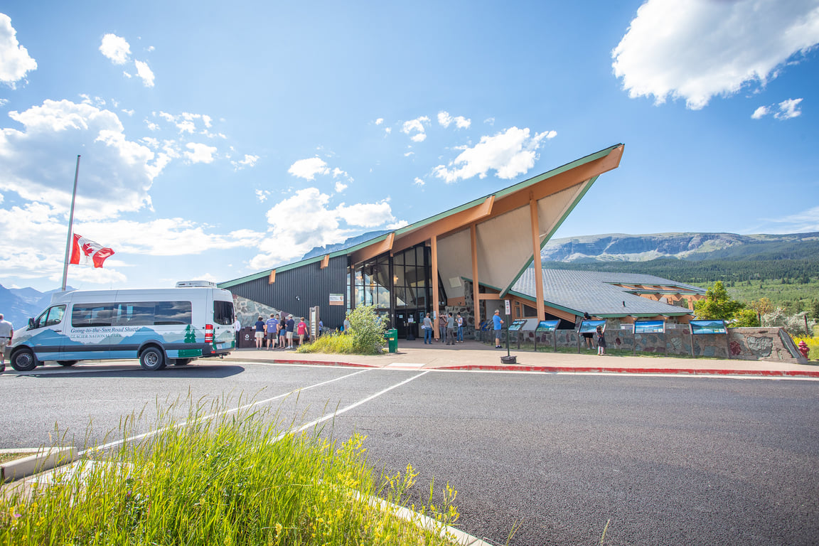 visitor center building with mountains in background