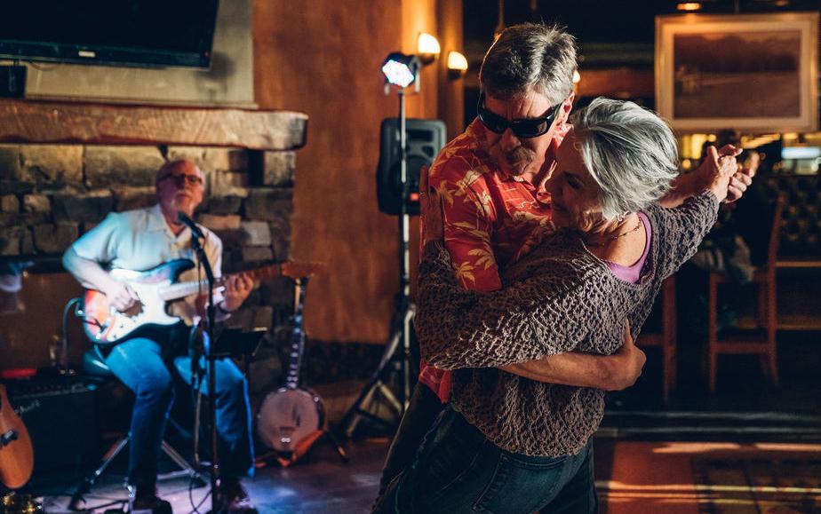 a couple dancing to live music