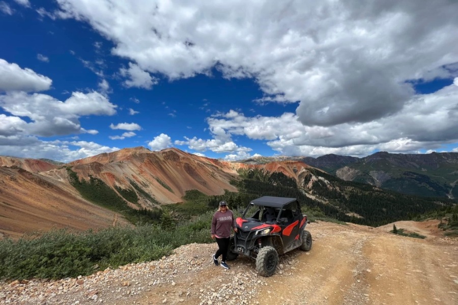 A woman enjoying a jeep ride