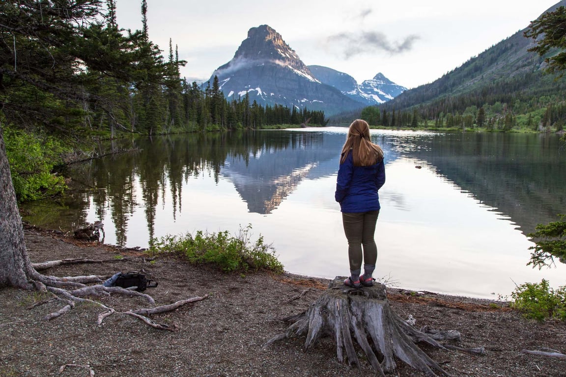 woman standing next to two medicine lake