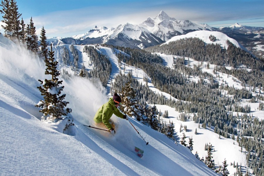 A man skiing in mountains