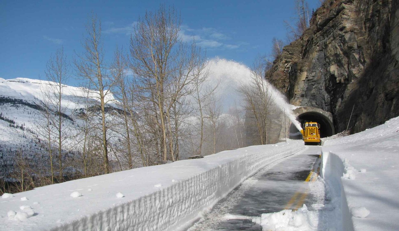 a snow plow along going-to-the-sun road