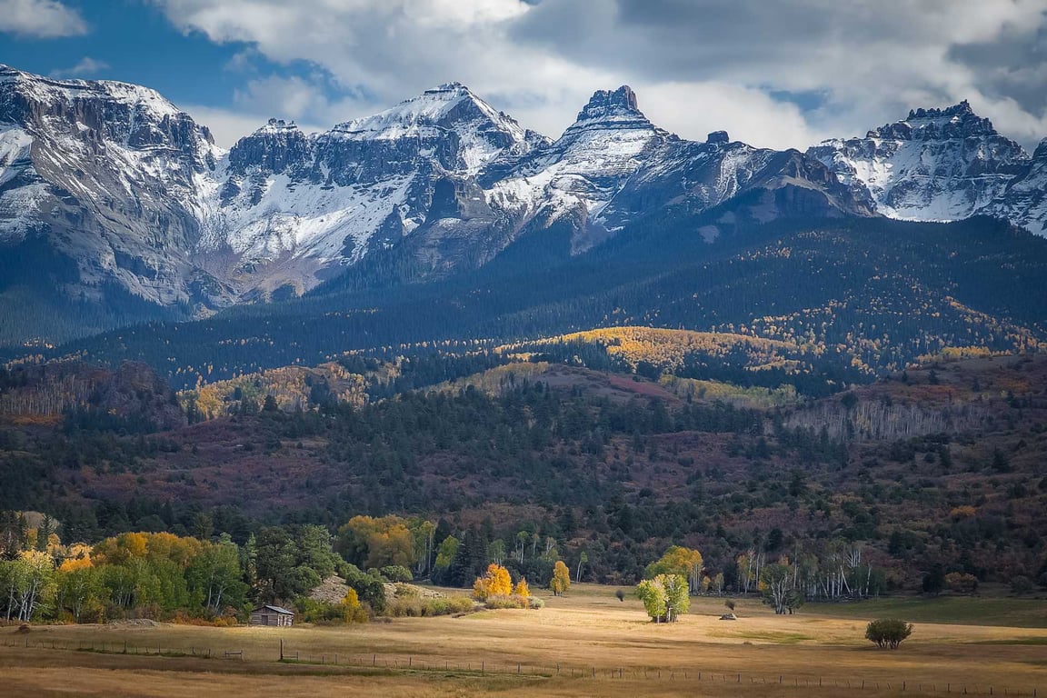 fall colors with large snow mountains behind