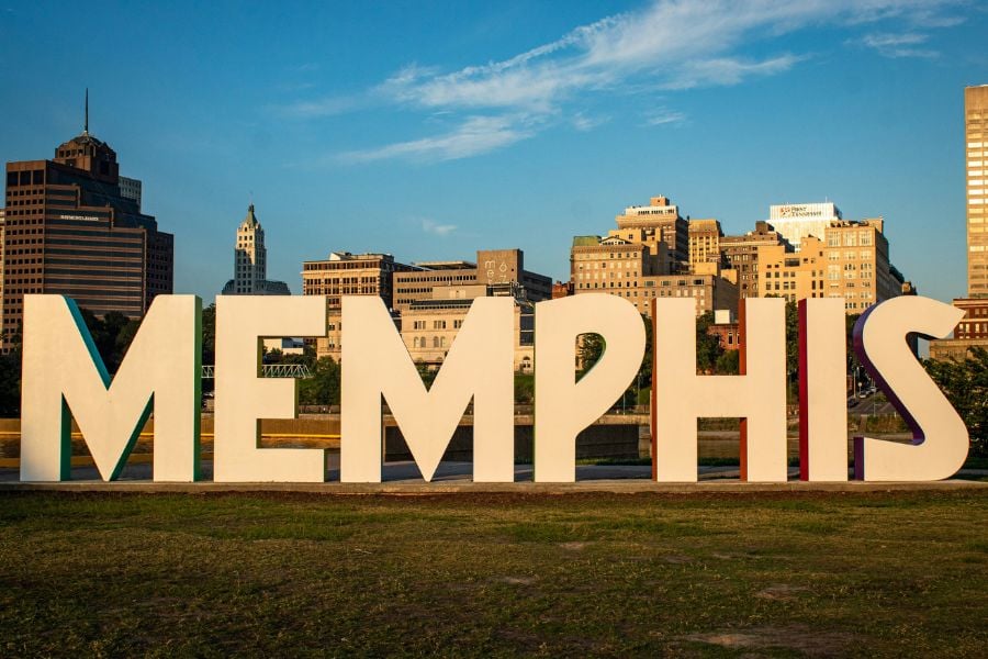 Giant white “Memphis” letters stand tall in front of the downtown skyline.