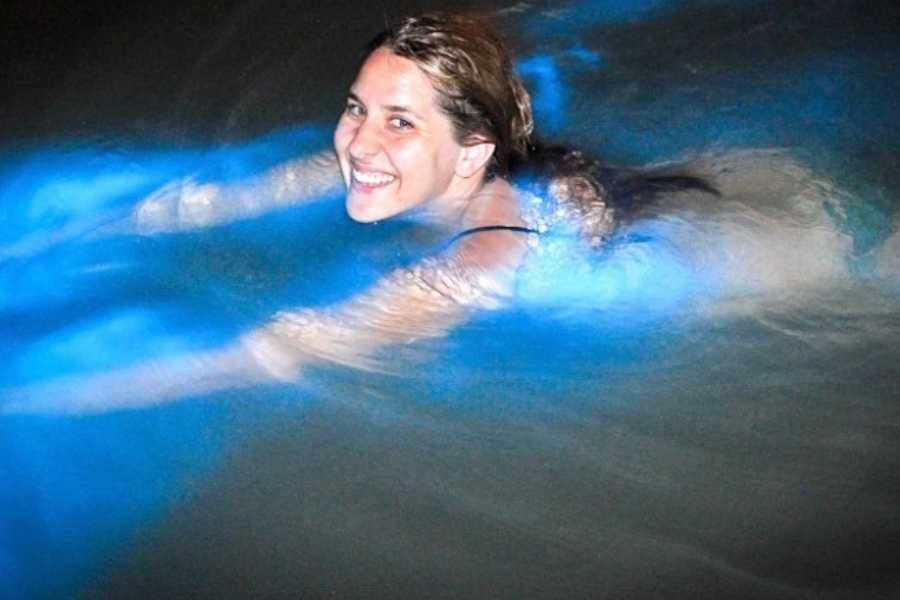 A woman stretches forward, creating a glowing blue trail.