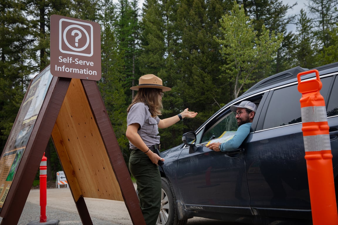 A ranger giving information to a visitor