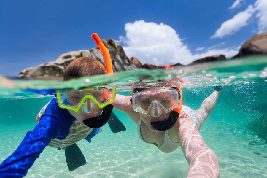 Two people are diving in sea water