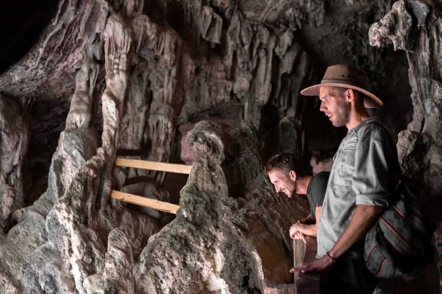 Two men are visiting the cave