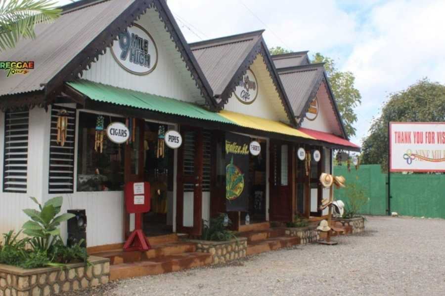 A lively shop with reggae colors selling cigars, souvenirs, and Jamaican memorabilia for visitors to enjoy.