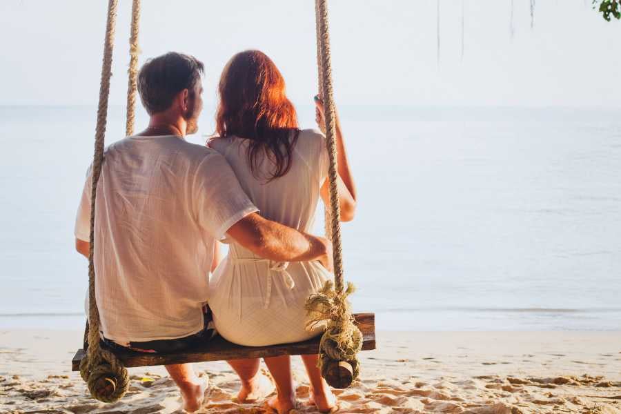 A couple enjoying the evening scene on the beach