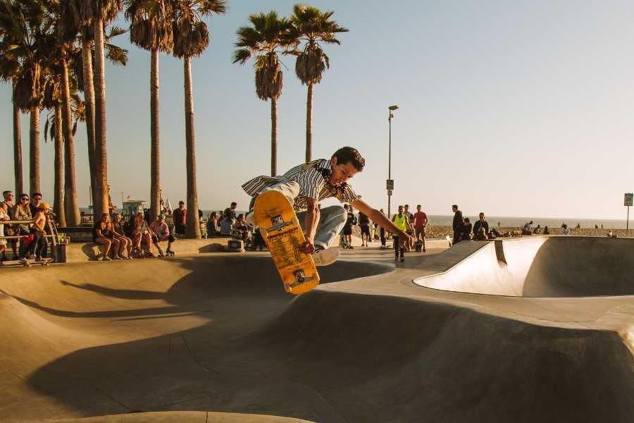 A boy is riding a skateboard