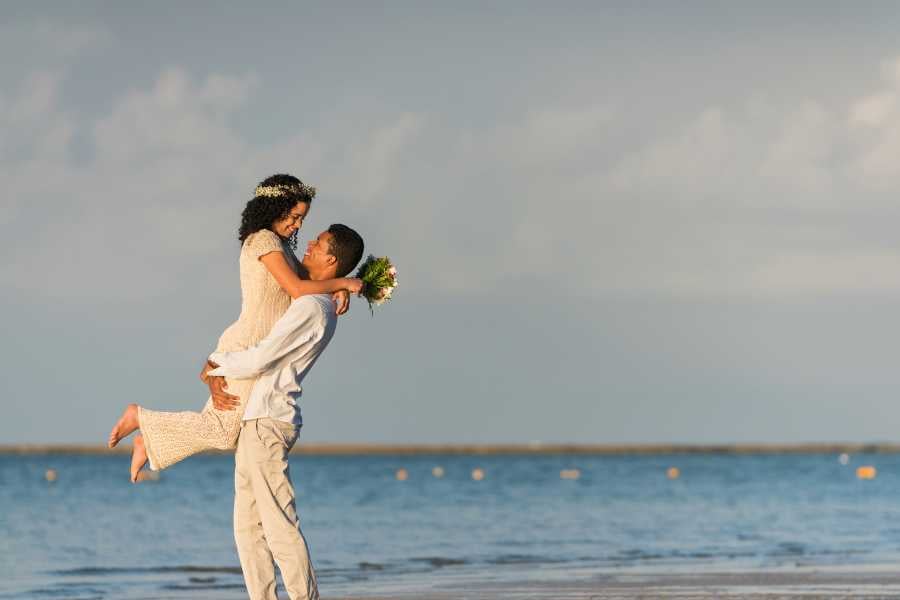 A couple is having fun on the beach