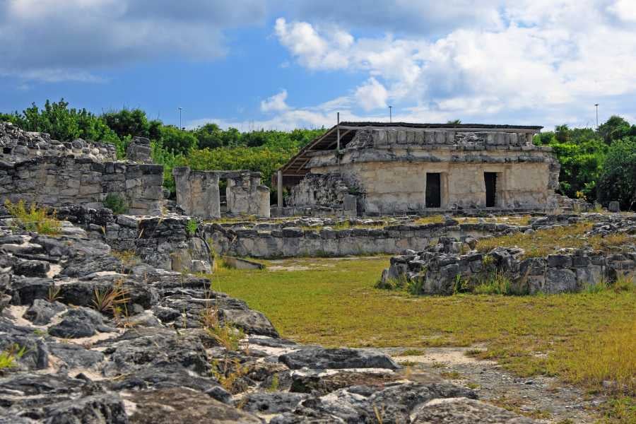 Explore the timeless beauty of ancient stone ruins under a bright blue sky, rich with history and stories.